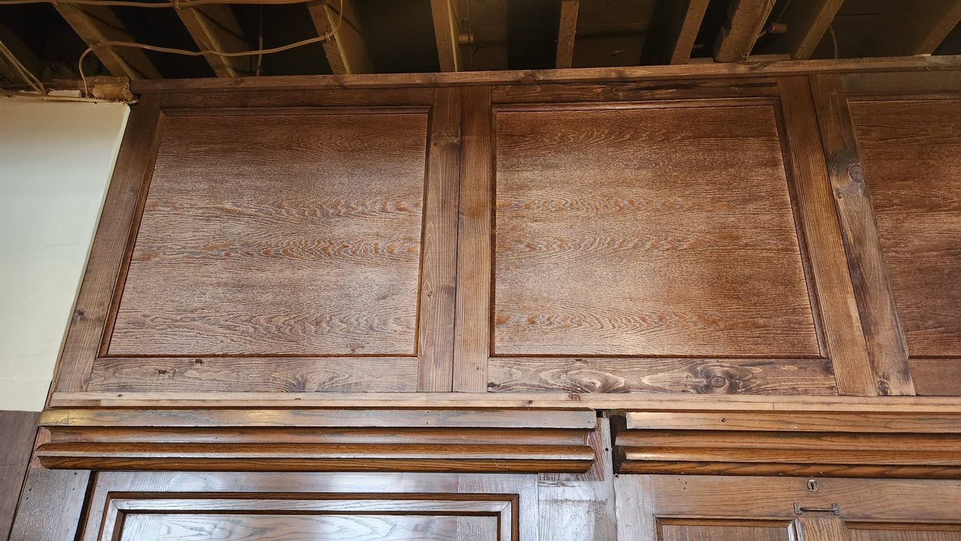 Close view of the new upper raised panels above the original lower wall panelling, built by Staged Right Carpentry