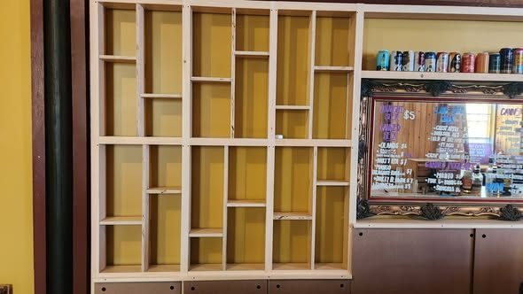 Custom display shelving unit with many compartments, built by Staged Right Carpentry